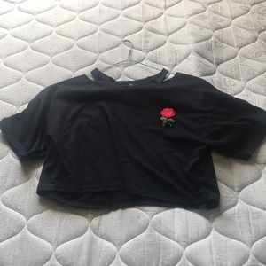 crops top with a rose on the chest area